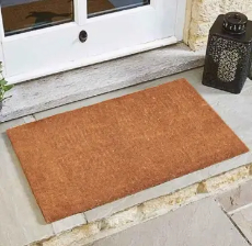 Photo of a coir mat at white door