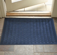 Photo of a black rubber mat on slate tiles